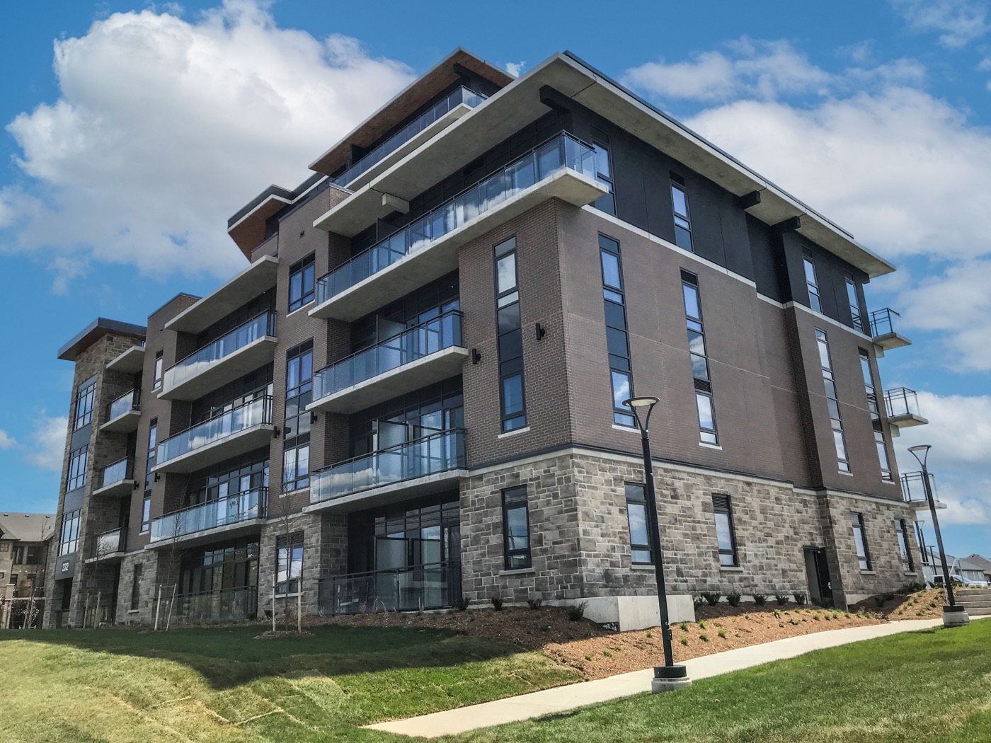 Apartment building with long runs of stone pattern precast cast on seamless liners