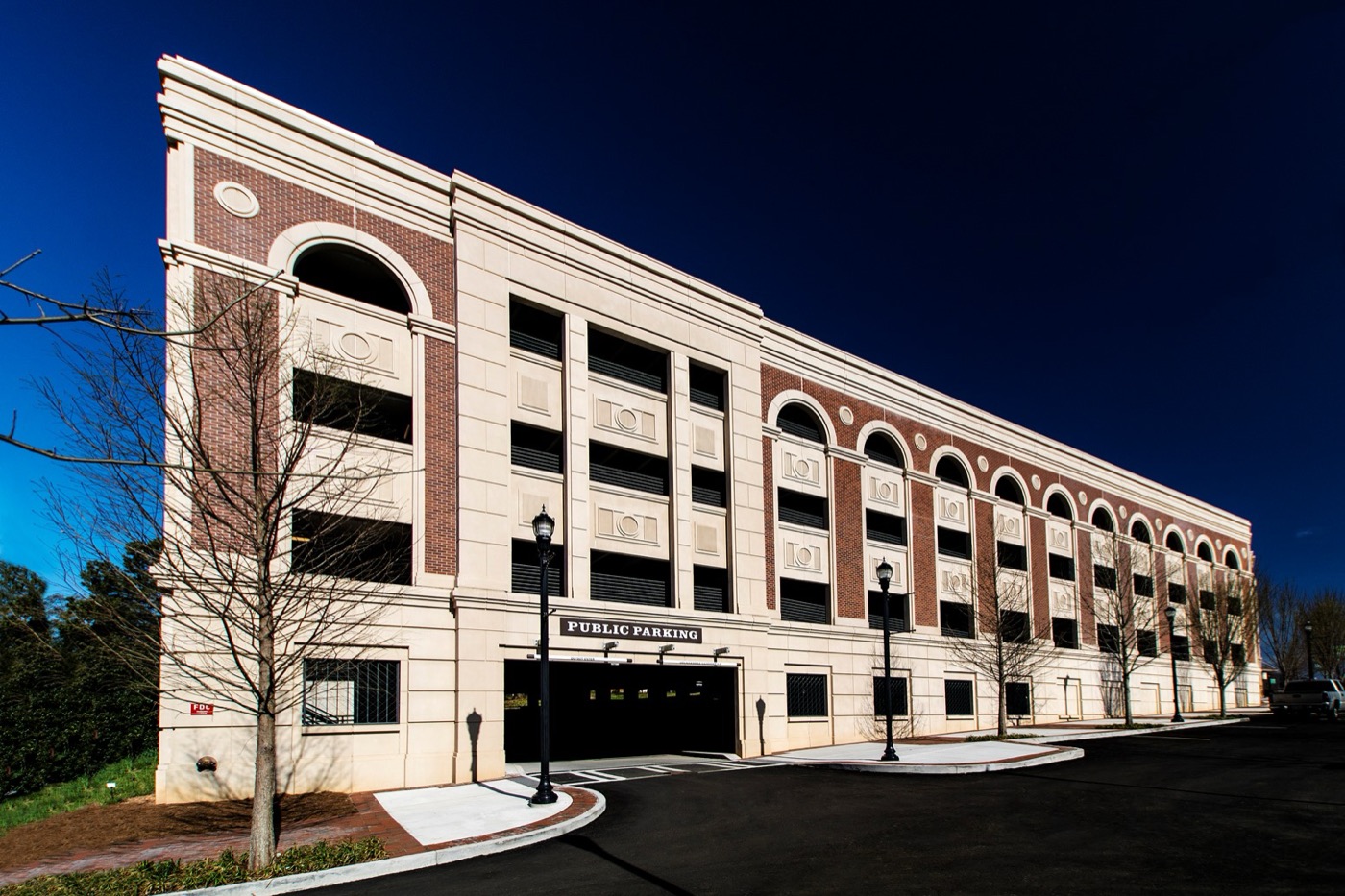 Parking structure with brick arches and columns cast as Solocast embedded thin brick panels