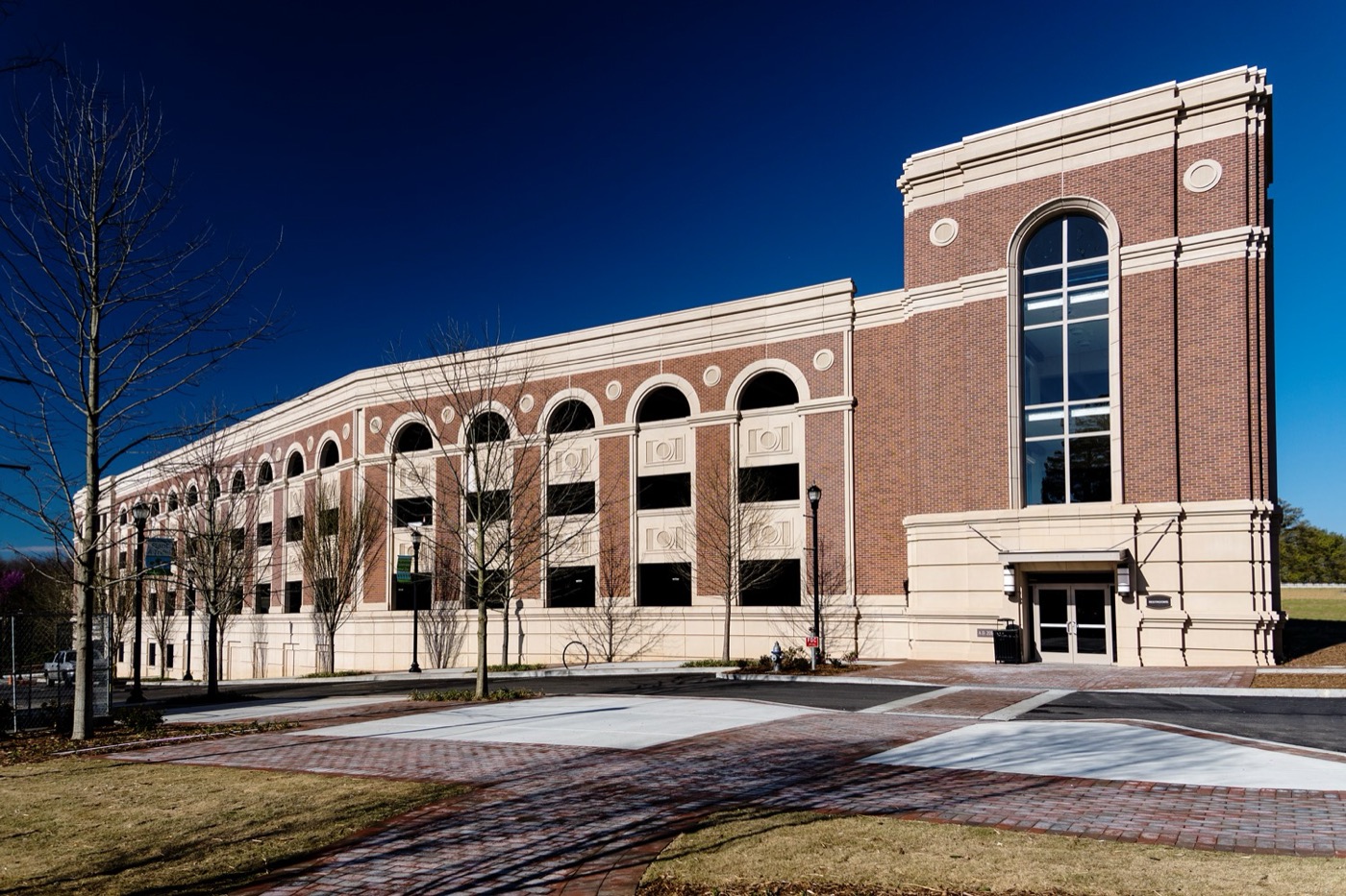 Parking structure faced with Solocast embedded thin brick panels, arches and a tower