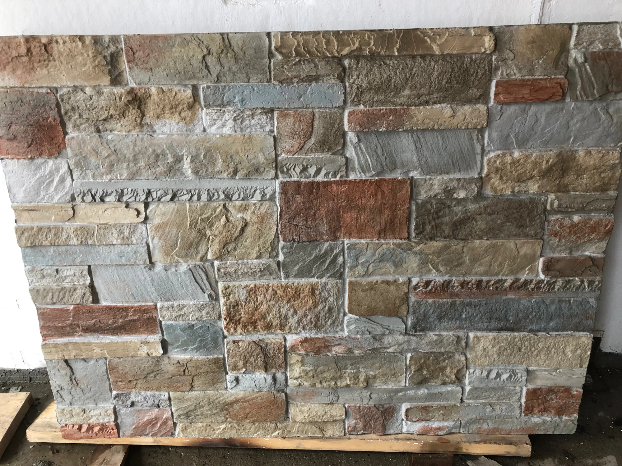 Eastern buff dry stack stone sample panel on a pallet