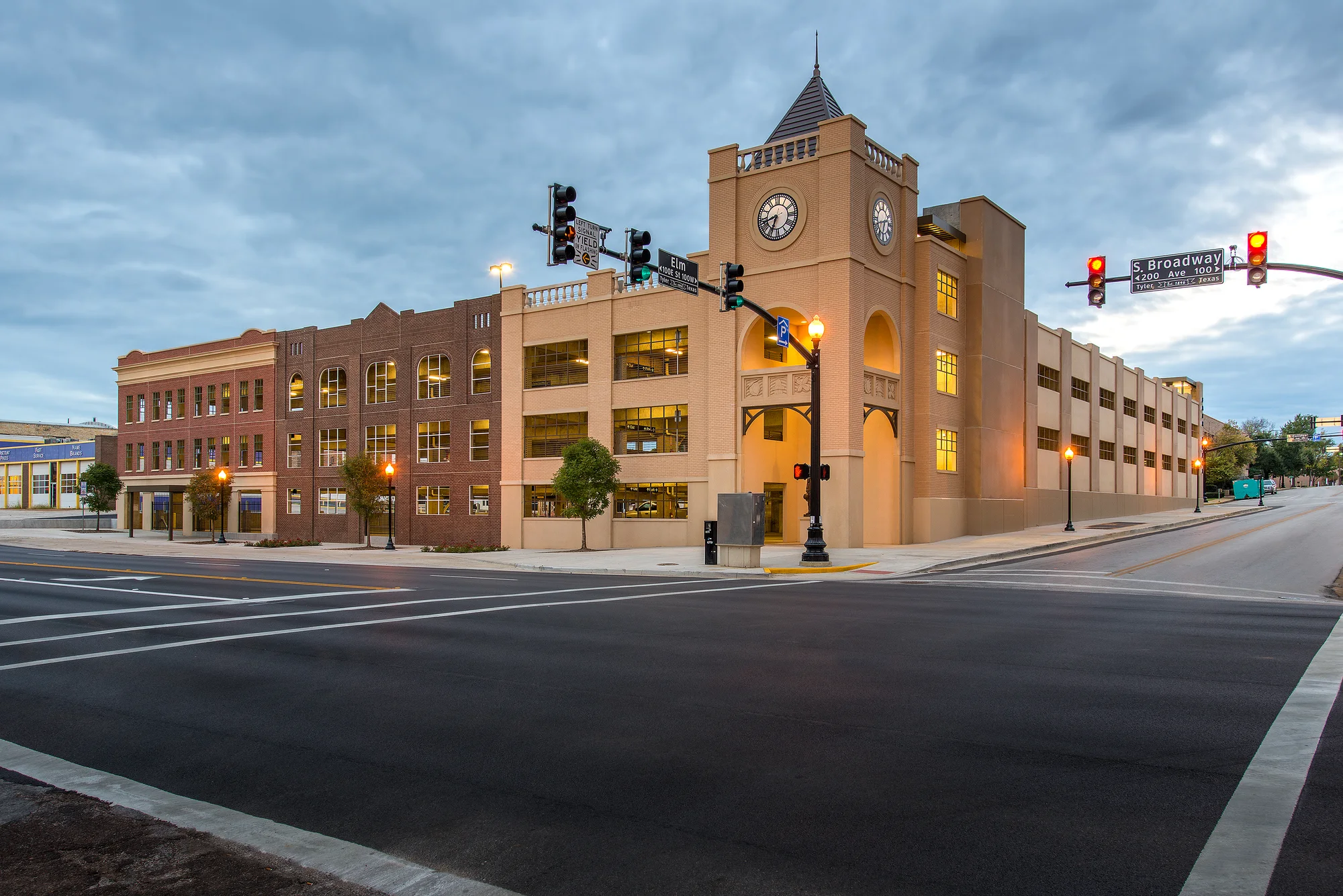 Brick-faced precast building on a street corner, cast with embedded thin brick on Flex2Fit