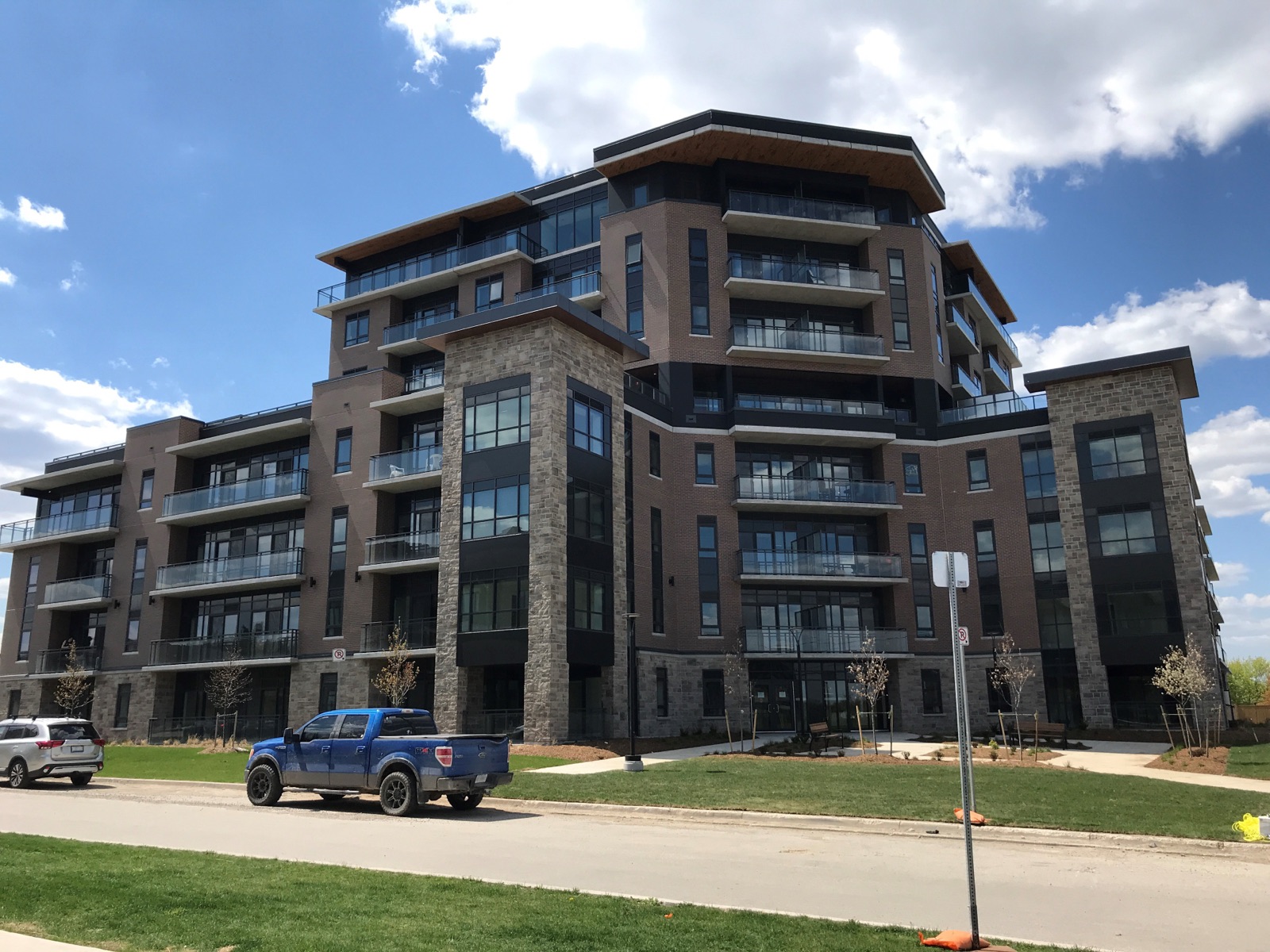 Apartment building faced with brick and stone precast panels cast on Advanced formliners
