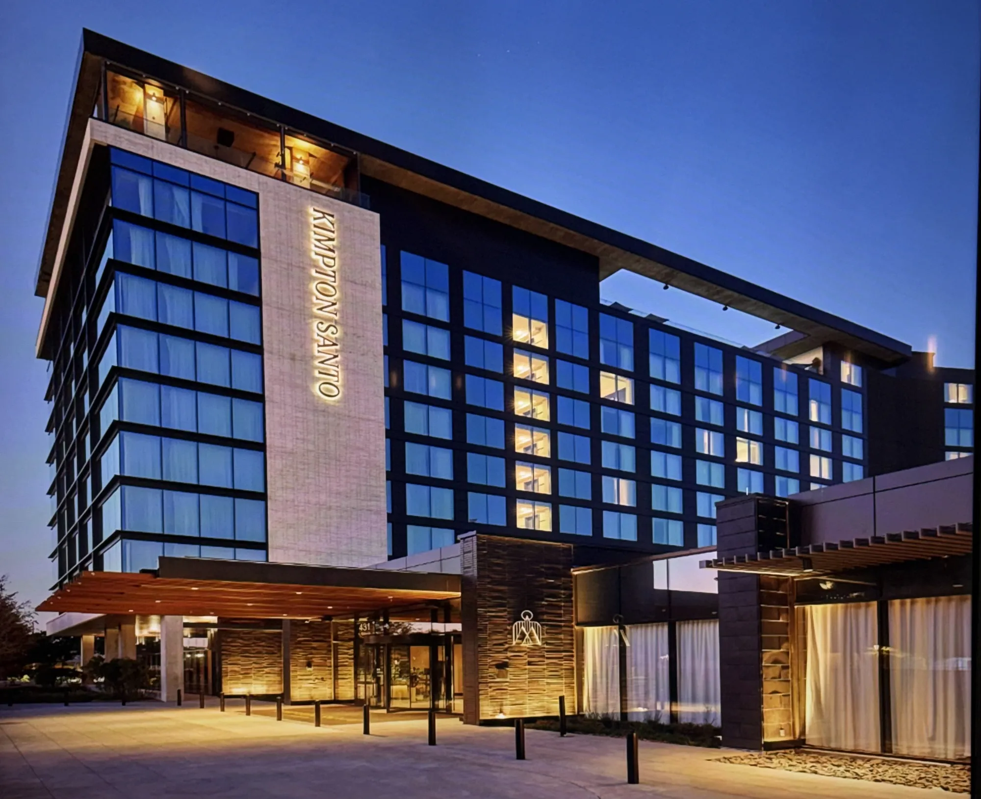 Kimpton Santo at dusk, the ten-story tower faced in dark King Klinker thin brick, San Antonio, Texas