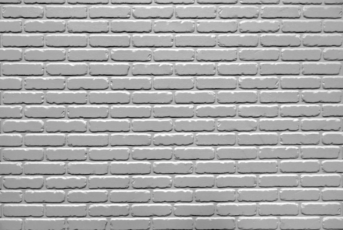 Half bond modular tumbled brick formliner pattern cast in concrete