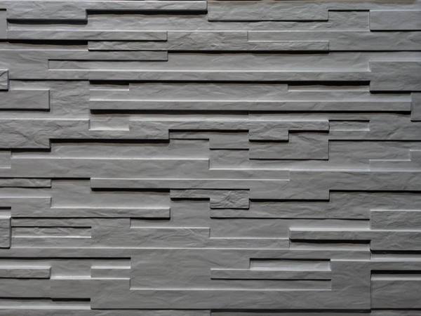 Random 1 and a half inch plank with varying depths textured formliner pattern cast in concrete